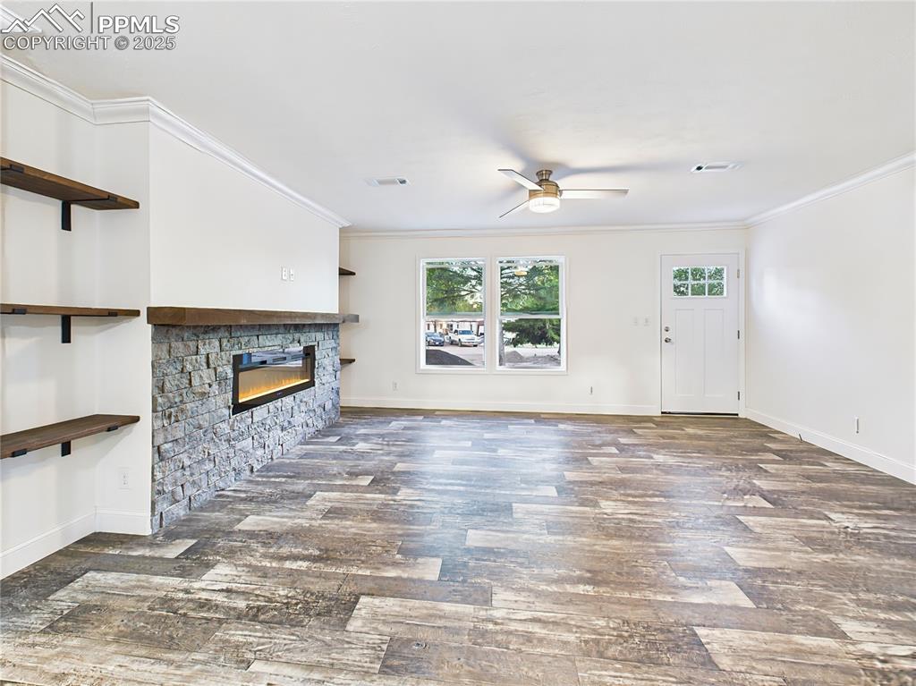 Image 10 of 50: Large windows flood the space with natural light.