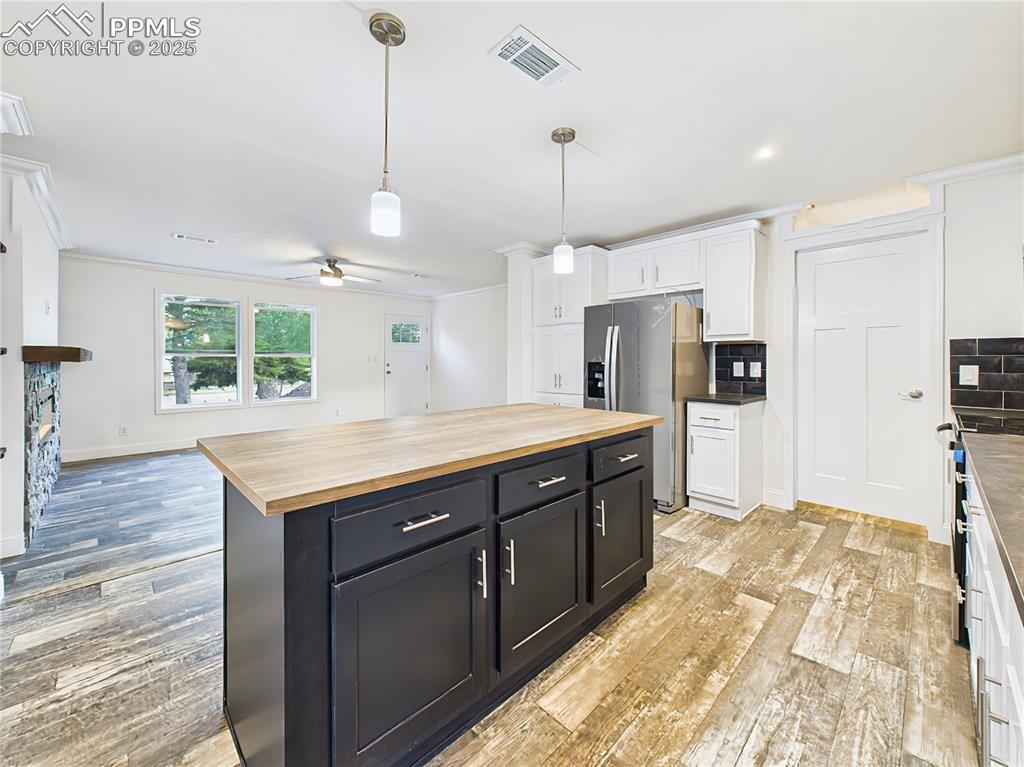 Image 15 of 50: Large island provides plenty of prep space and casual dining options.