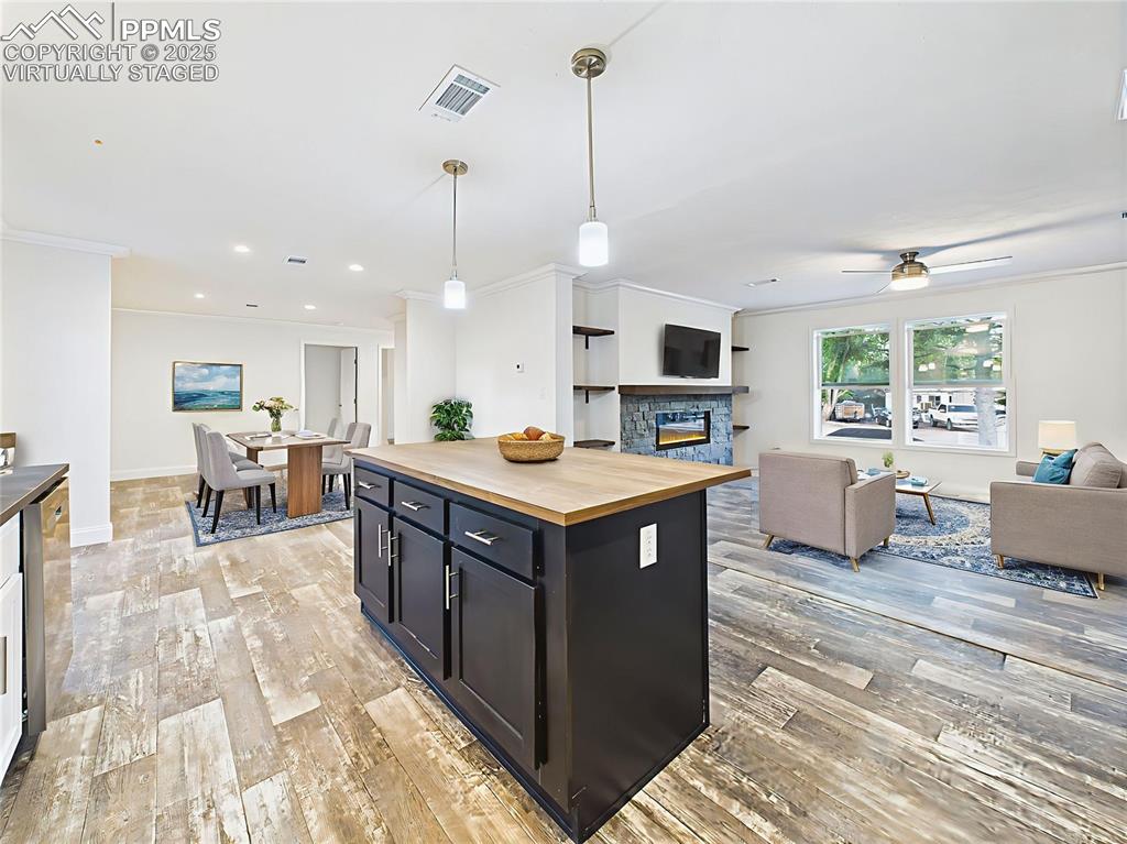 Image 17 of 50: Virtually Staged images highlight seating at the island and open sightlines