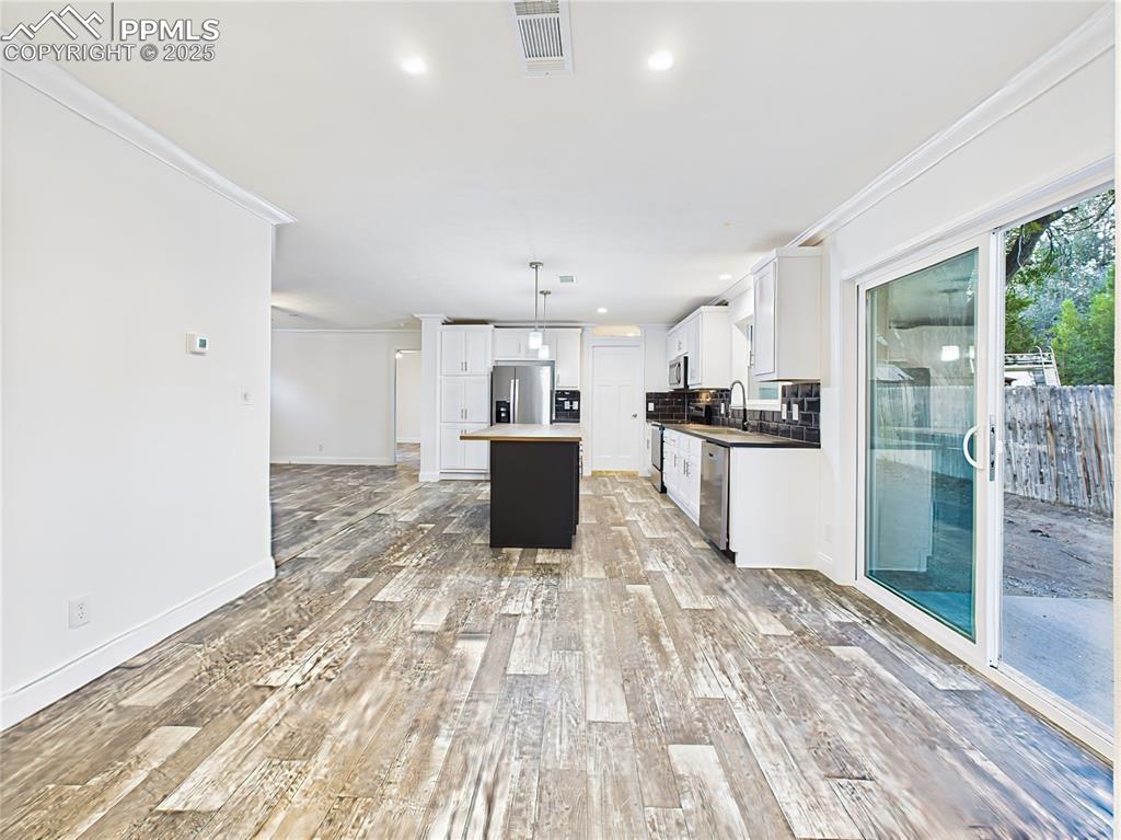 Image 23 of 50: Open-concept layout allows the kitchen, dining, and living areas to connect