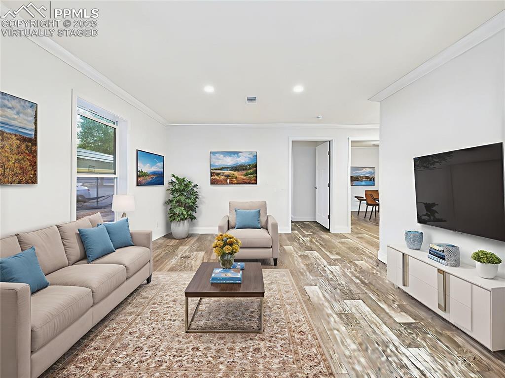 Image 26 of 50: Virtually Staged to demonstrate multiple layout options—cozy family TV spac