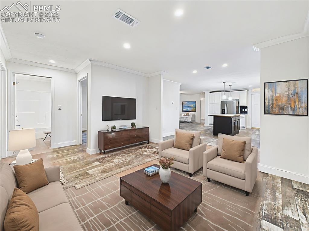 Image 28 of 50: Virtually Staged to demonstrate multiple layout options—cozy family TV spac