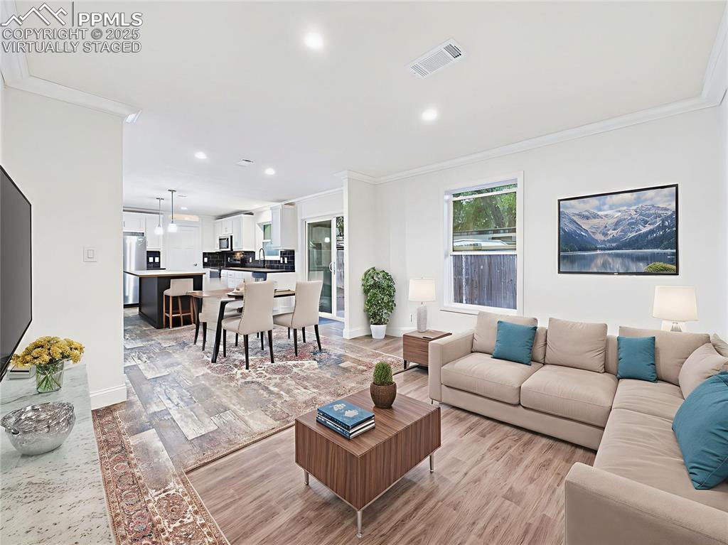 Image 30 of 50: Virtually Staged to demonstrate multiple layout options—cozy family TV spac