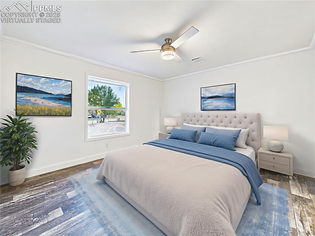 Image 32 of 50: Virtually staged version shows layout options with a king bed, nightstands,