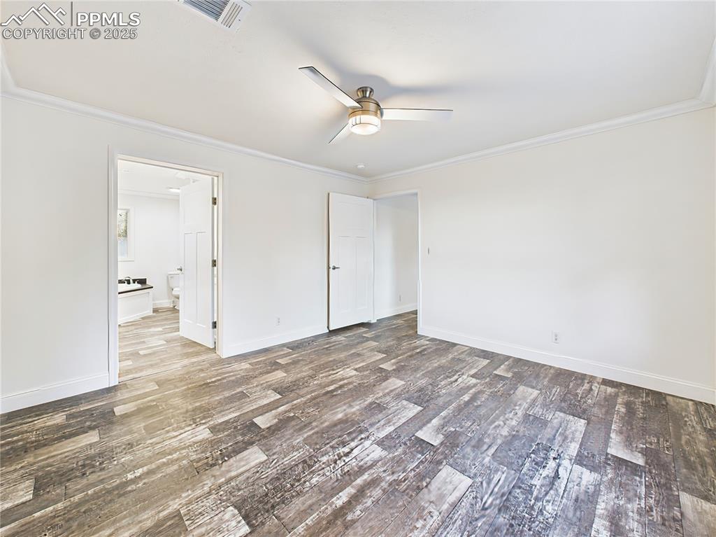 Image 33 of 50: Looking back at 5 Piece bedroom, walk in closet, Ceiling fan with light fix