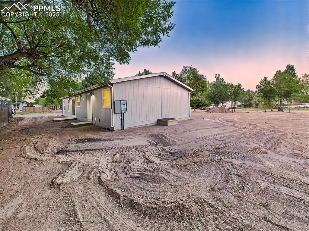 Image 47 of 50: Multiple angles show side and backyard space with potential for landscaping