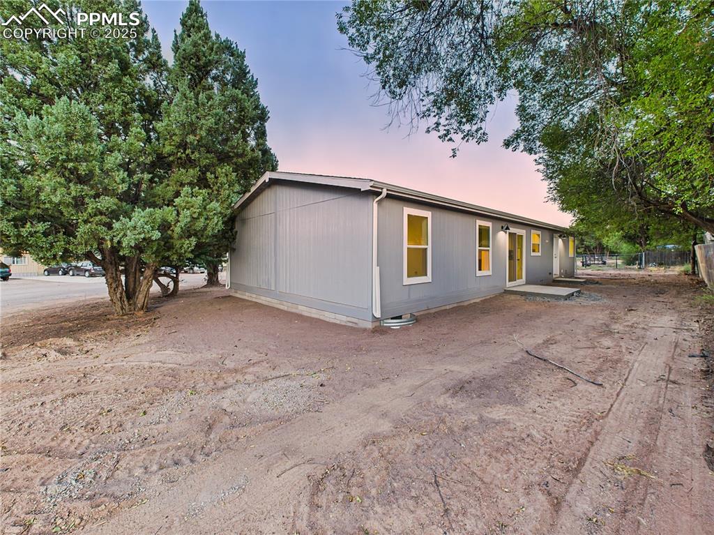 Image 49 of 50: Multiple angles show side and backyard space with potential for landscaping