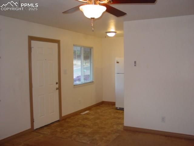 Image 10 of 16: 2002 Front entry to living room and kitchen
