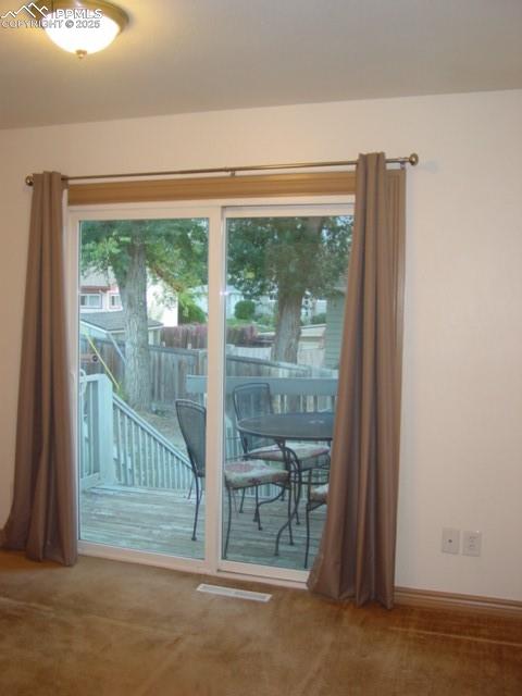 Image 16 of 16: 2002 Bedroom Slider to deck and yard