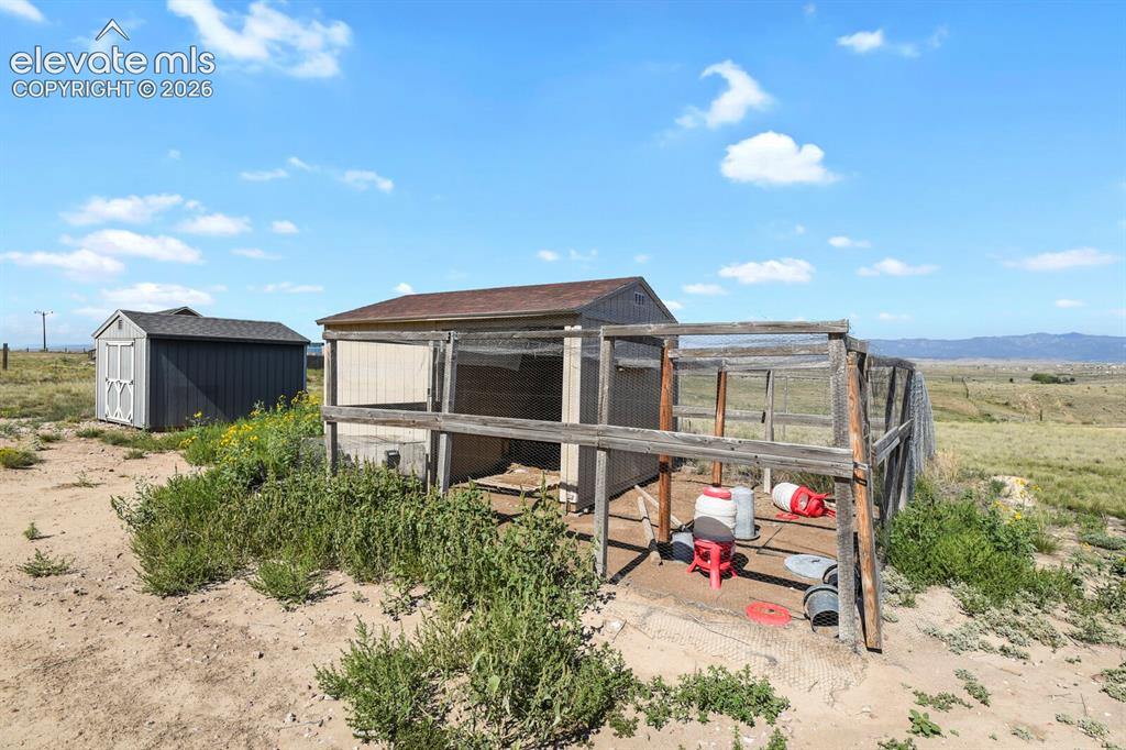 Image 33 of 44: Chicken coop and loafing shed comes with the house.