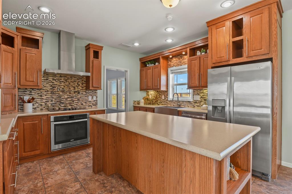 Image 9 of 44: The large center island is perfect for entertaining and everyday use. 
