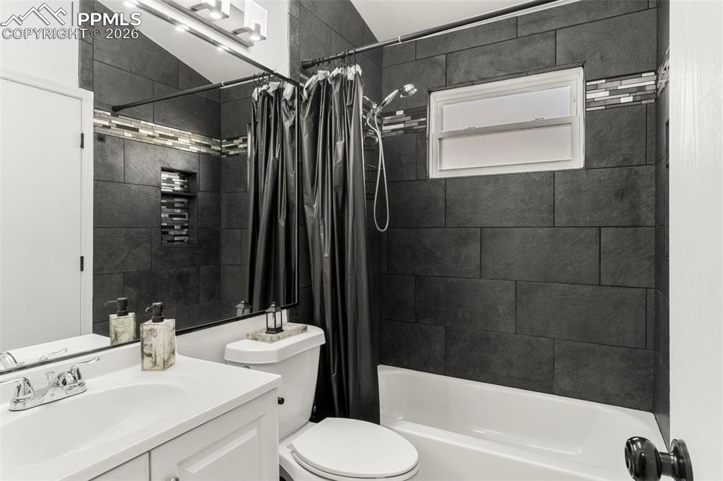 Image 13 of 29: Full bath featuring vanity and shower / tub combo