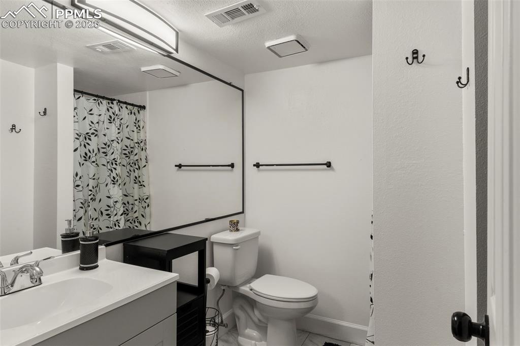 Image 21 of 29: Bathroom downstairs