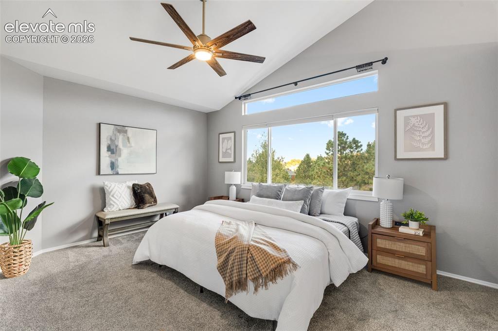 Image 18 of 36: Vaulted ceiling featuring a central multi-blade ceiling fan, large picture 
