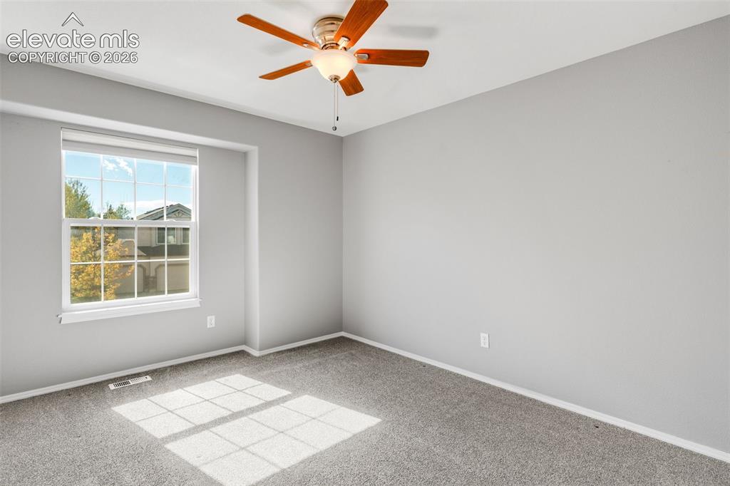 Image 25 of 36: Interior room featuring neutral wall paint, wall-to-wall carpeting, a multi
