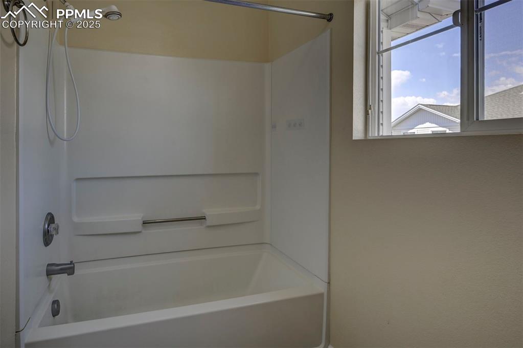 Image 18 of 26: Bathroom featuring shower / tub combination