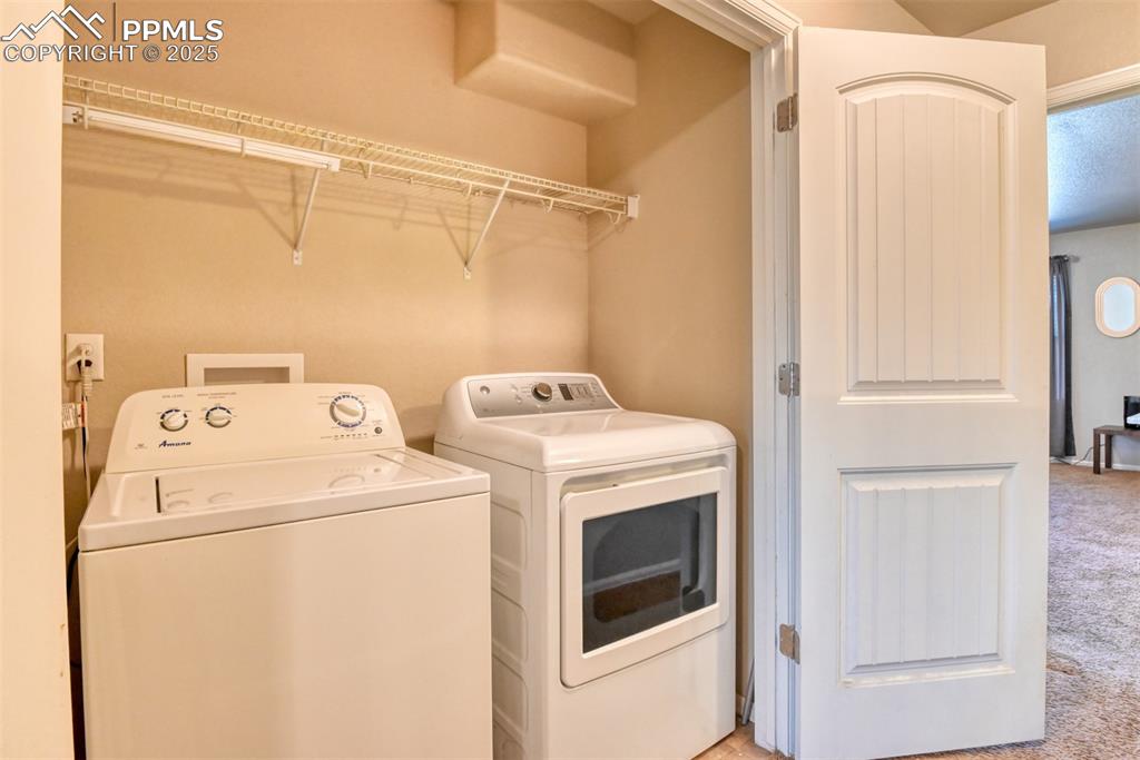 Image 11 of 28: laundry area on the upper level near bedrooms