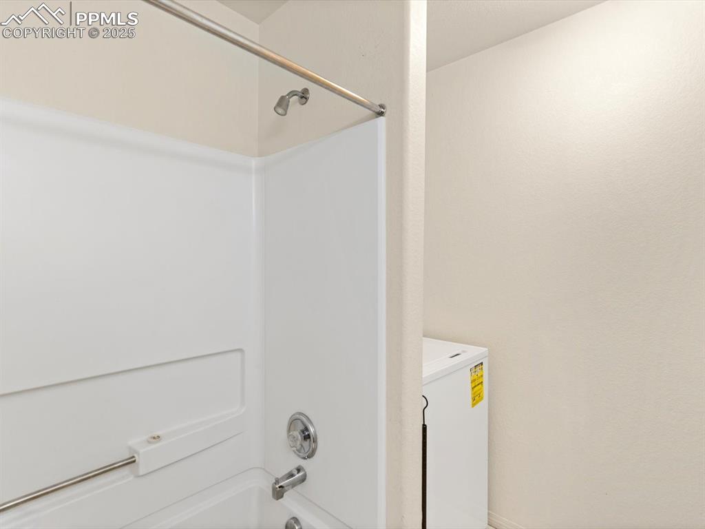 Image 15 of 30: Full bath with laundry room, upstairs