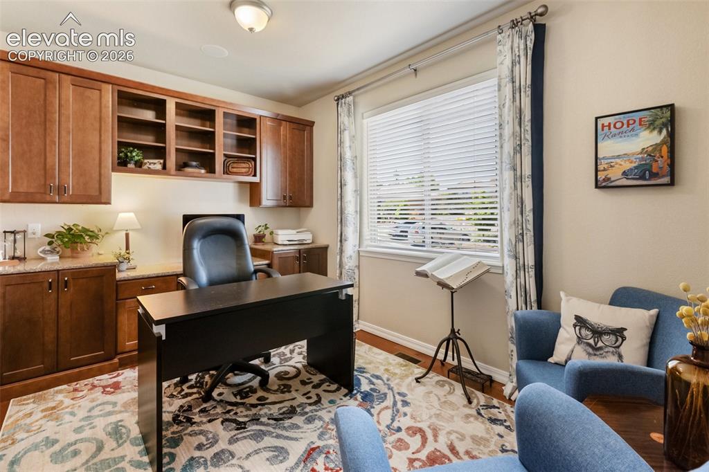 Image 34 of 43: Wet bar and family room