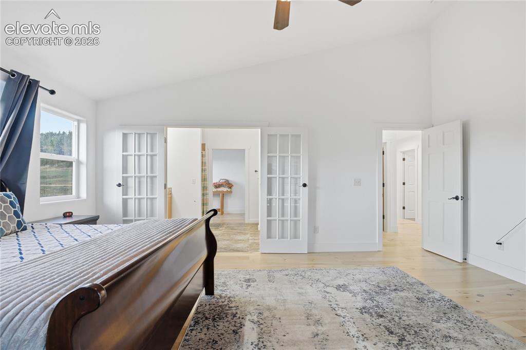 Image 21 of 45: Upper Primary Suite with 5 PC Bath and Walk-out to Large Covered Deck