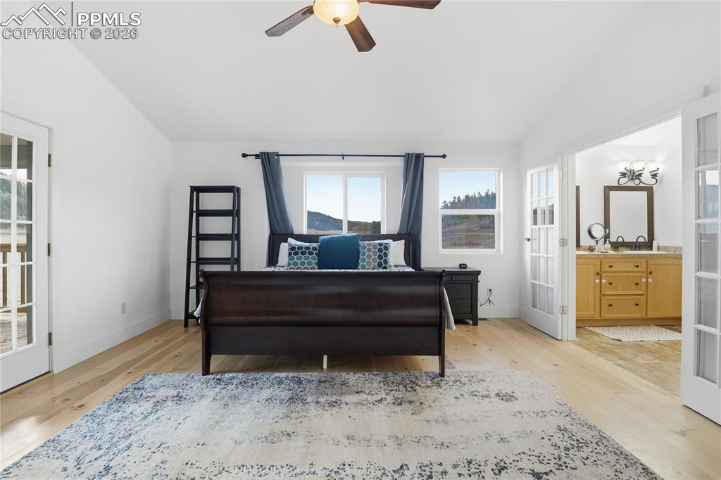 Image 23 of 45: Upper Primary Suite with 5 PC Bath and Walk-out to Large Covered Deck