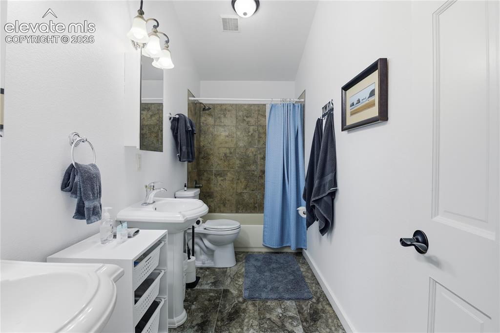 Image 30 of 45: 2nd Upper Full bathroom, double Pedestal Sink, lofted ceiling,