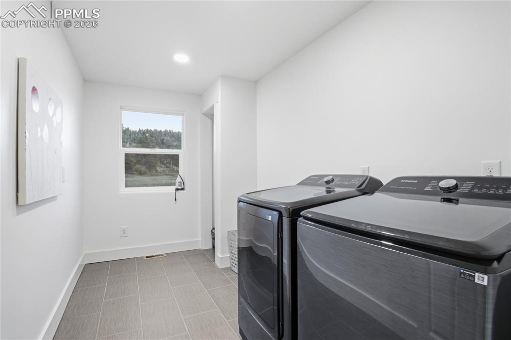 Image 40 of 45: Upper Level Large Laundry