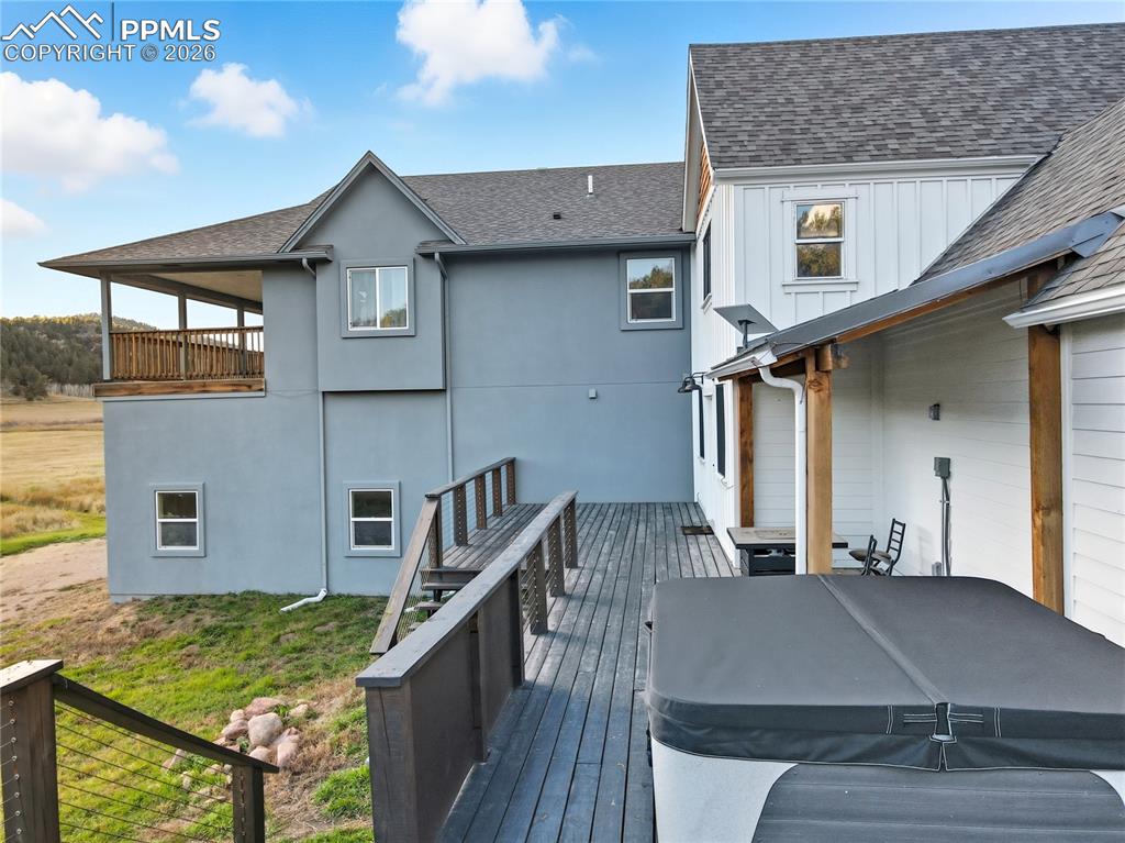 Image 6 of 45: Large Deck off of the Living Room w/ Hot Tub