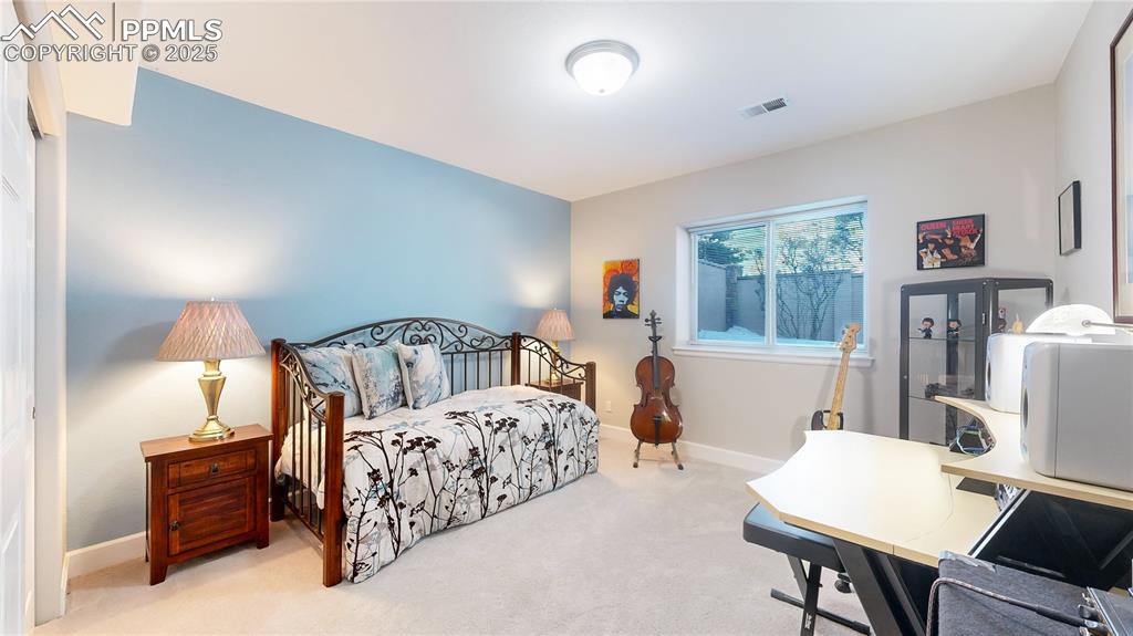 Image 20 of 34: Bedroom with carpet flooring and baseboards