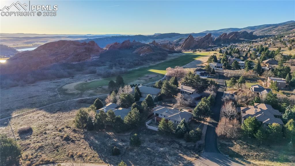 Image 27 of 34: Aerial view at dusk of a mountain view and a residential view