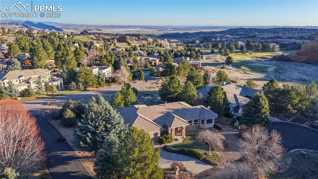 Image 28 of 34: Aerial view of residential area featuring mountains
