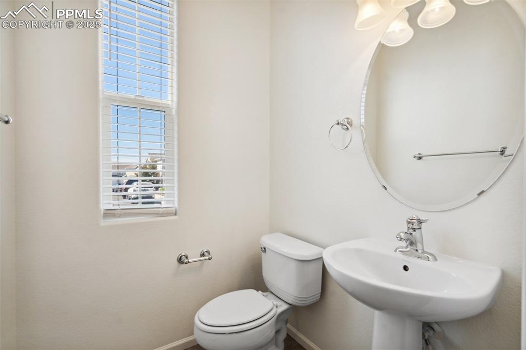 Image 16 of 28: Bathroom featuring baseboards