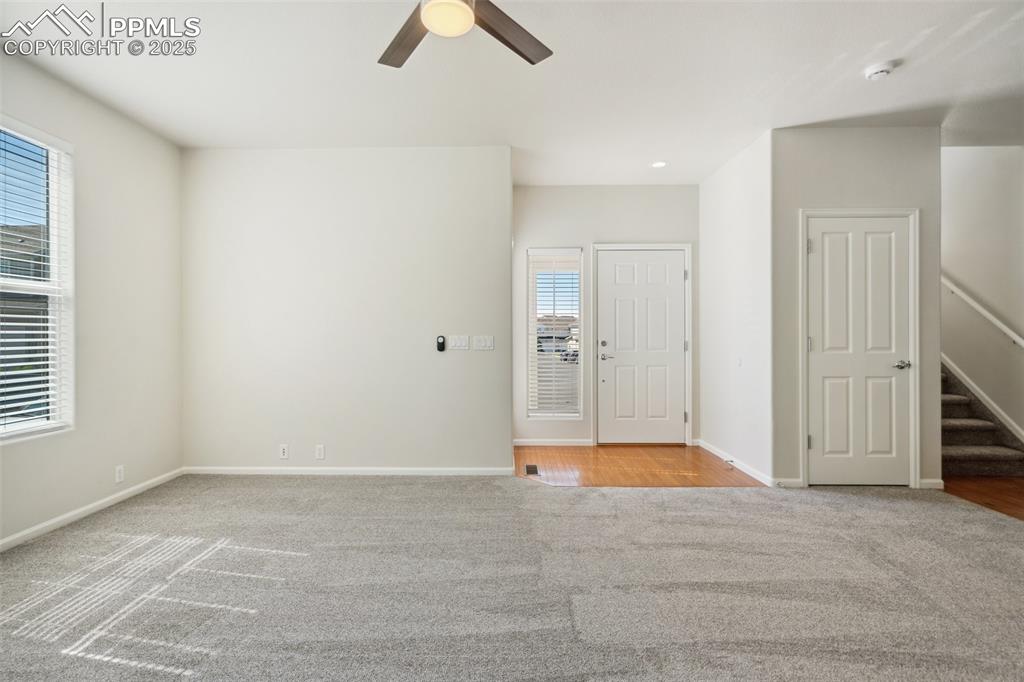 Image 6 of 28: Unfurnished room with carpet floors, healthy amount of natural light, a cei