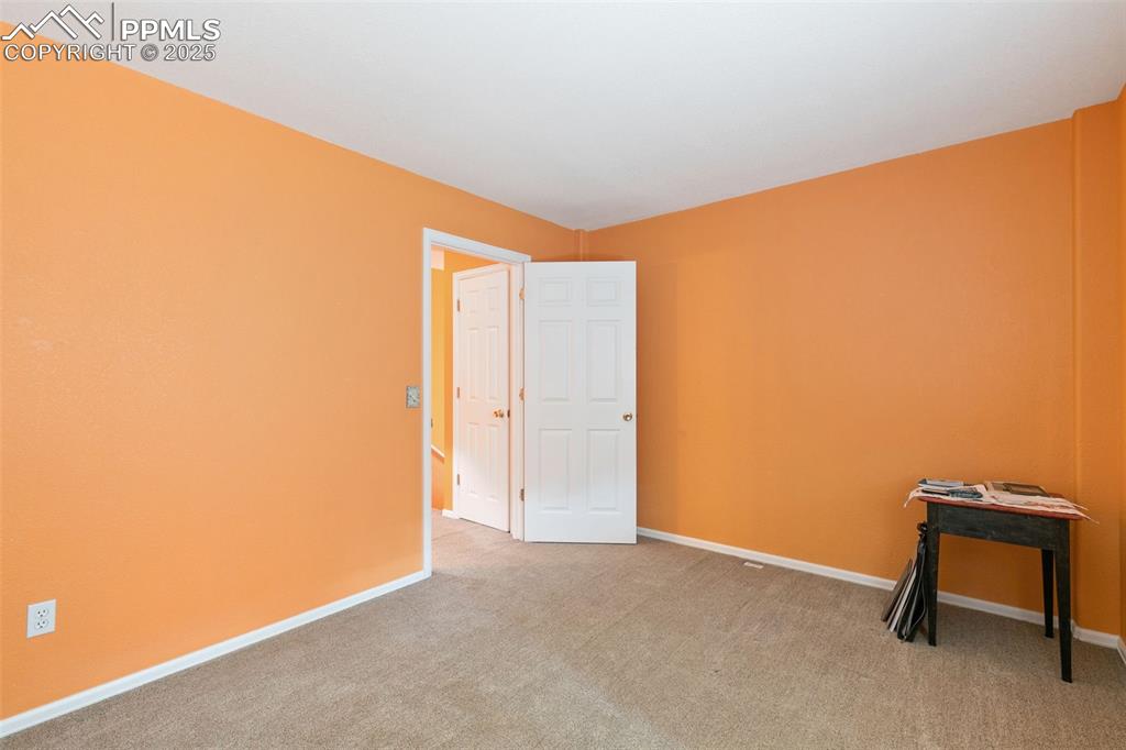 Image 26 of 29: Spare room featuring light colored carpet and baseboards