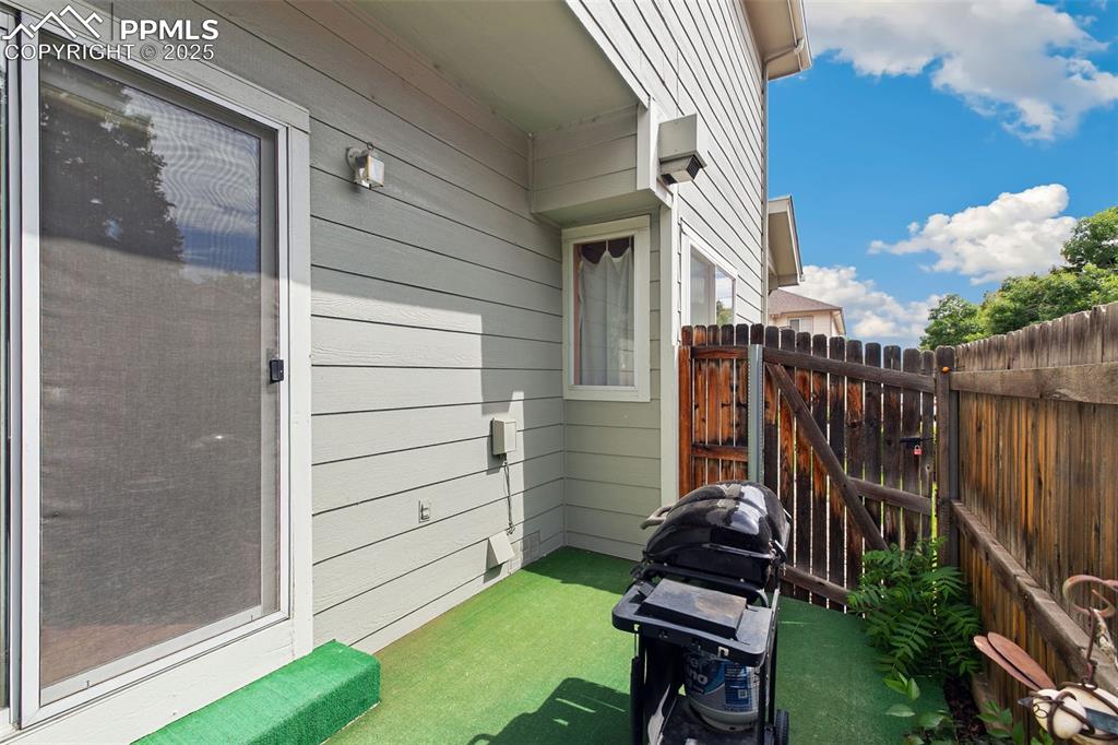 Image 29 of 29: View of patio / terrace featuring area for grilling and a gate