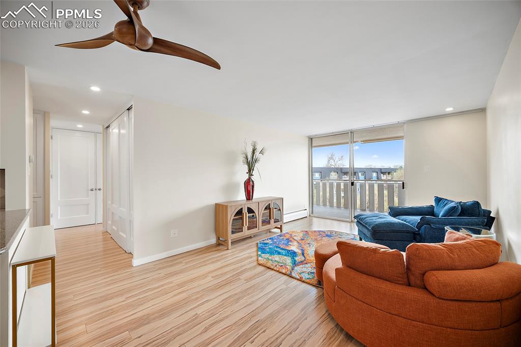 Image 4 of 41: Living Room and Walk-Out Balcony