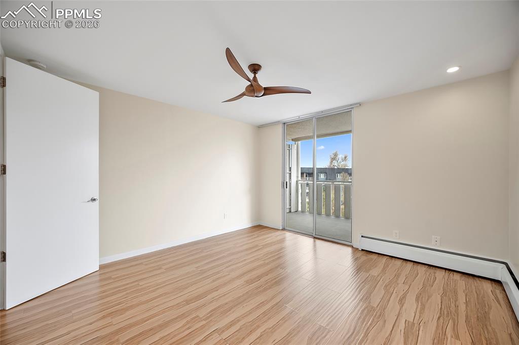 Image 7 of 41: Primary Bedroom with Walk-out Balcony