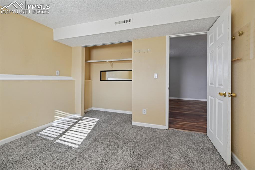 Image 17 of 25: Downstairs bedroom