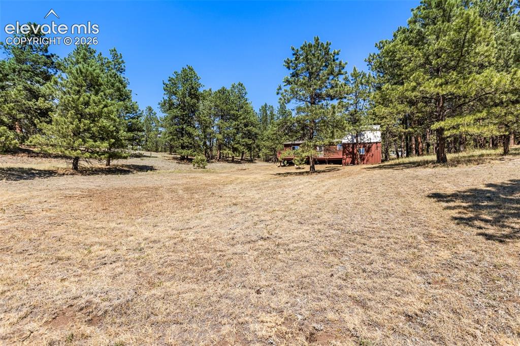 Image 2 of 22: Back of Property and house