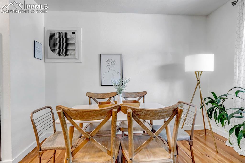 Image 4 of 35: Dining room featuring light wood-type flooring