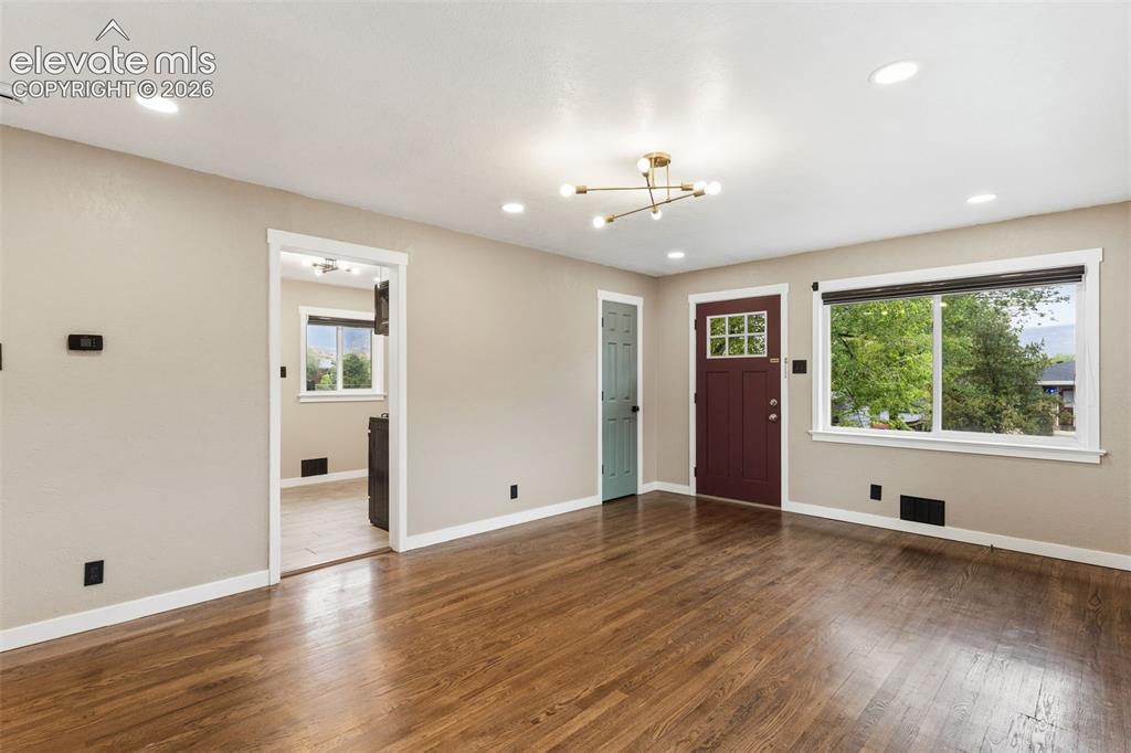 Image 9 of 38: Unit #1 Entry & Family Room