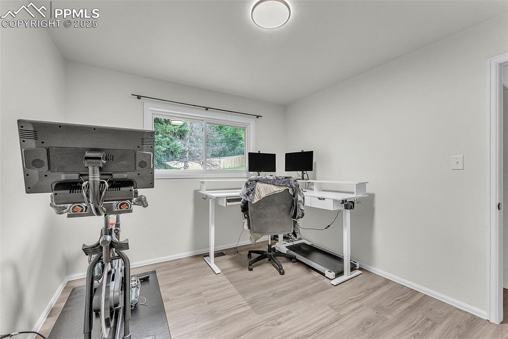 Image 12 of 38: Main Level: Bedroom #1; currently being used as Home Office