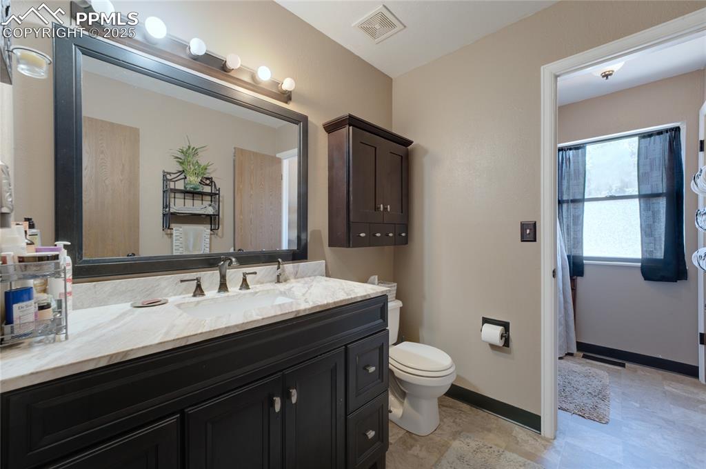 Image 18 of 35: Full bathroom featuring vanity and toilet