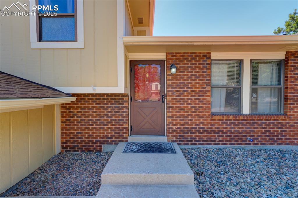 Image 3 of 35: View of exterior entry featuring brick siding