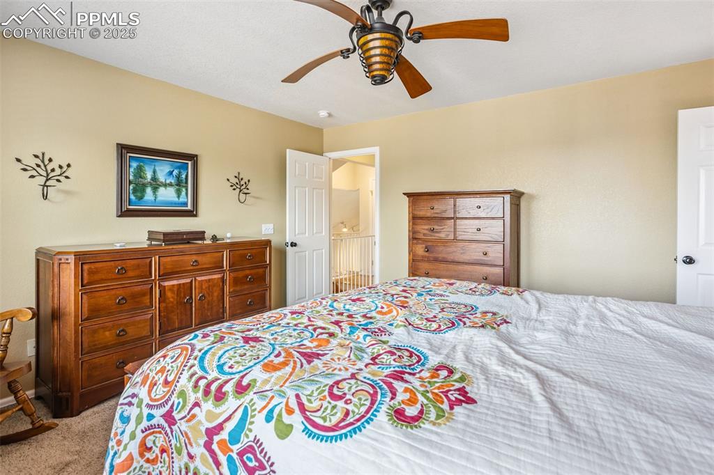 Image 18 of 32: Bedroom featuring carpet flooring and ceiling fan