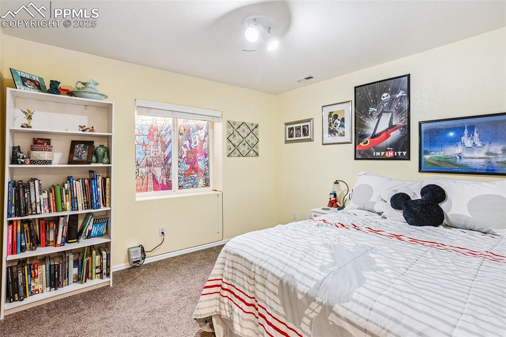Image 20 of 32: Bedroom with carpet and baseboards
