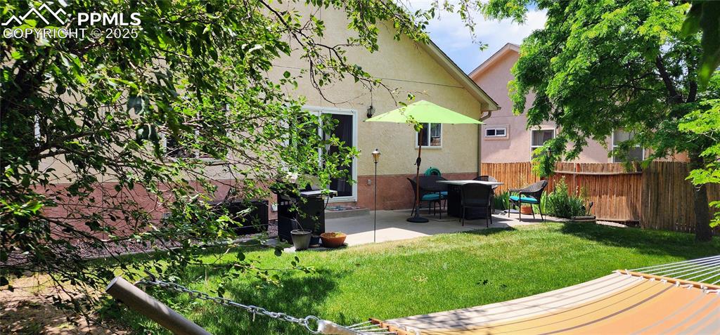 Image 32 of 32: View of yard featuring a patio and a wooden deck