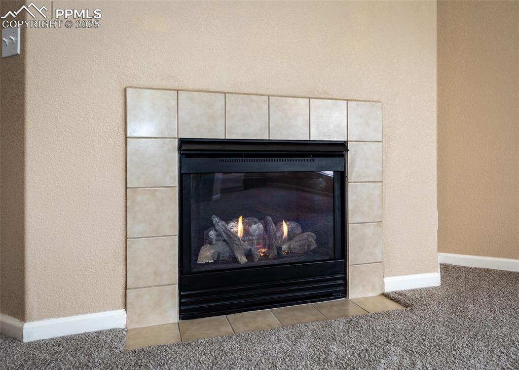 Image 28 of 45: Fireplace in living room
