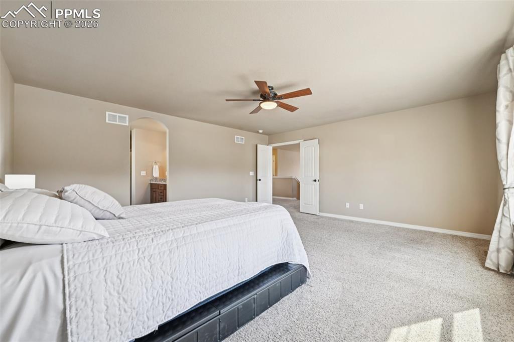 Image 17 of 41: Oversized bedroom with large sitting area