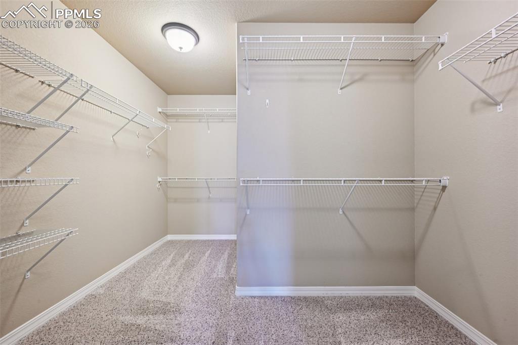 Image 22 of 41: HUGE walk in closet!